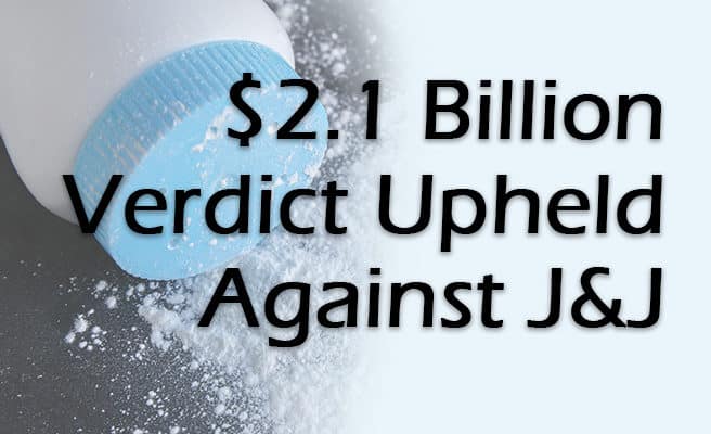 Talcum powder bottle with a blue cap and powder on a table representing Johnson & Johnson talcum powder