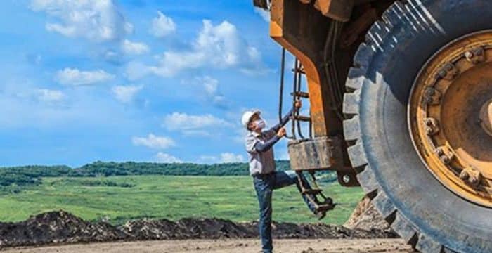 man climbing a trailer