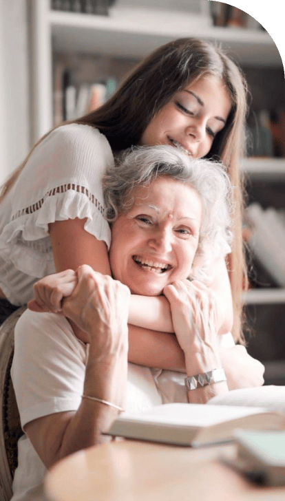 a woman hugging her grandmother