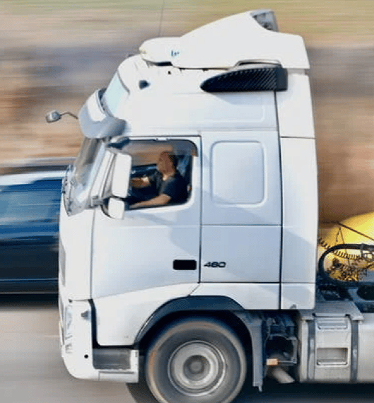 a man driving a semi-truck
