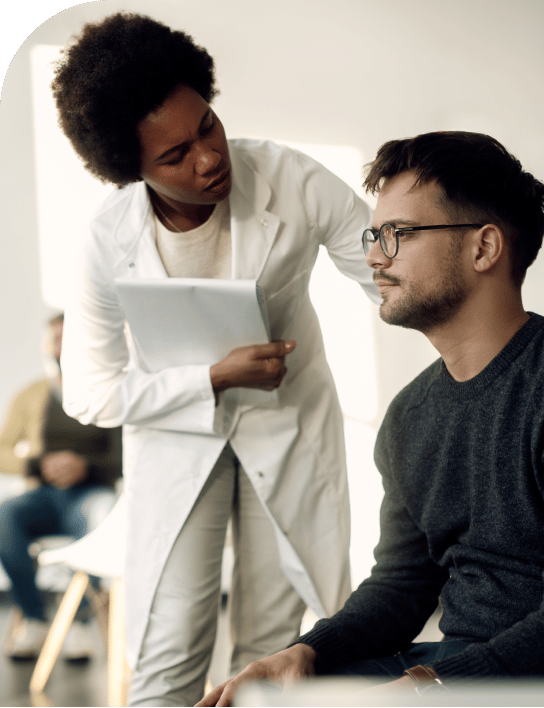 Nurse comforting a man