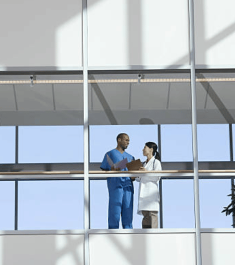 medical practitioners discussing at the hospital hallway