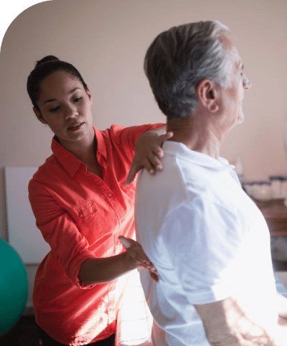 a doctor examines a patient's spine