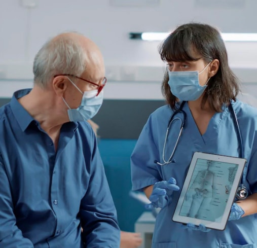 doctor showing the patients an x-ray