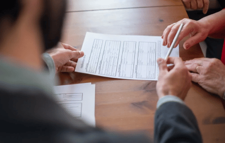 two people reviewing tax documents