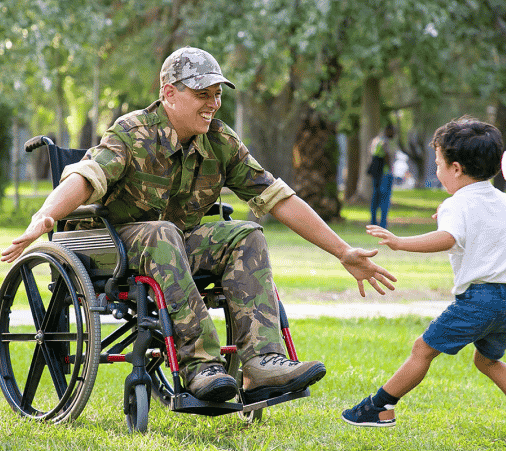 a disabled veteran playing with his son
