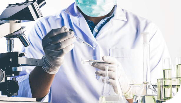 Lab worker wearing gloves and mask