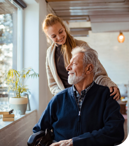 A lady comforting an elderly man