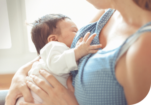 woman breastfeeding her child