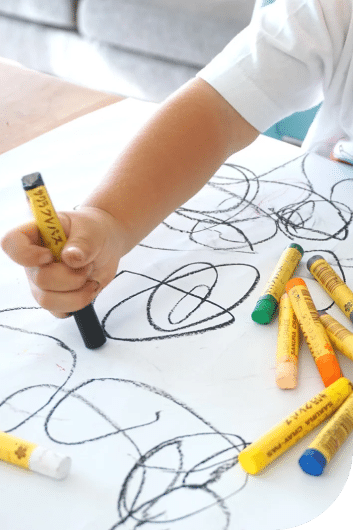 boy coloring a paper