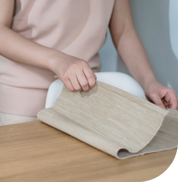 woman folding a material