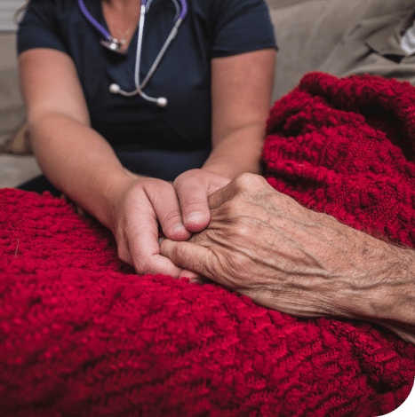 doctor holding an elderly person hand