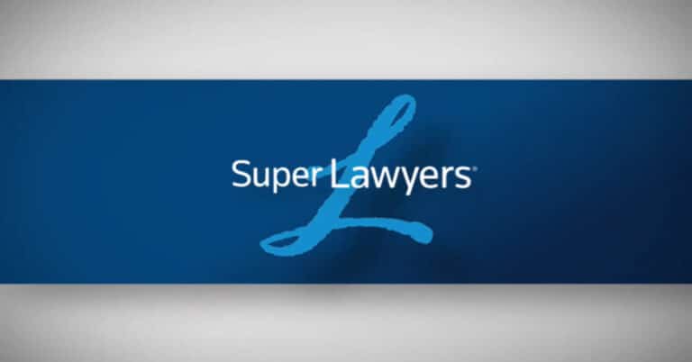 The "L" of Lanier Law Firm with the logo of Super Lawyers in front