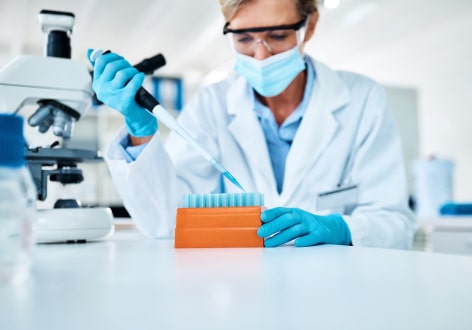 Scientist in a lab testing samples for a clinical trial