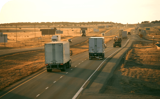 semitrucks driving down highway