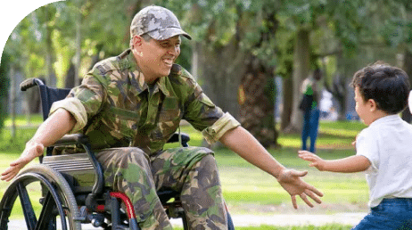 man in army uniform in wheelchair greeting young girl