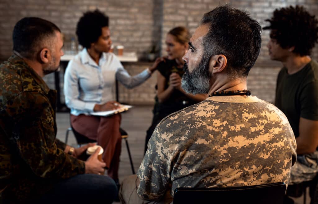 army veterans sitting in support group