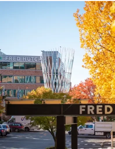 The Fred Hutch Cancer Center with tress in autumn