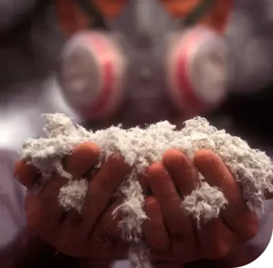 California worker holding asbestos fibers with both hands and wearing a protective mask