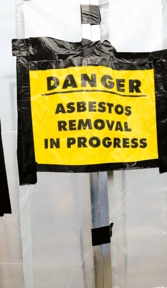 Yellow sign that reads "danger, asbestos removal in progress"