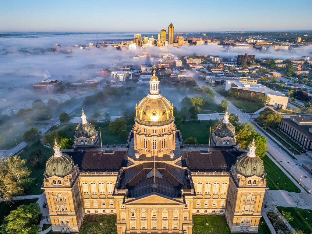 Des Moines, Iowa, USA with the Capitol Building on a misty morning.