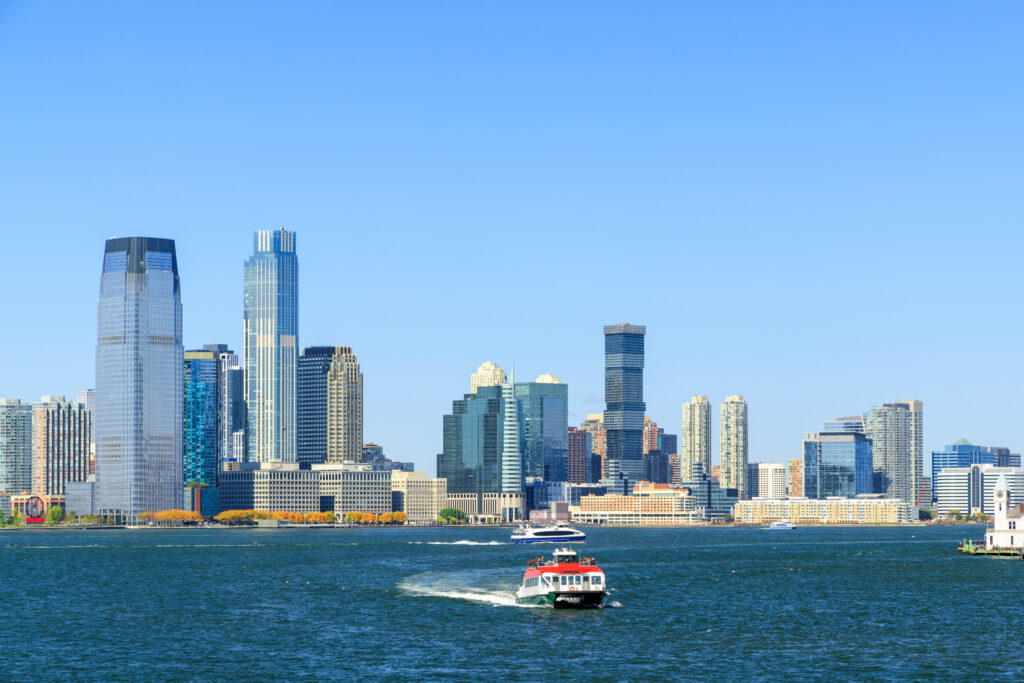 Jersey City skyline in New Jersey. Skyscrapers panorama across the Hudson river