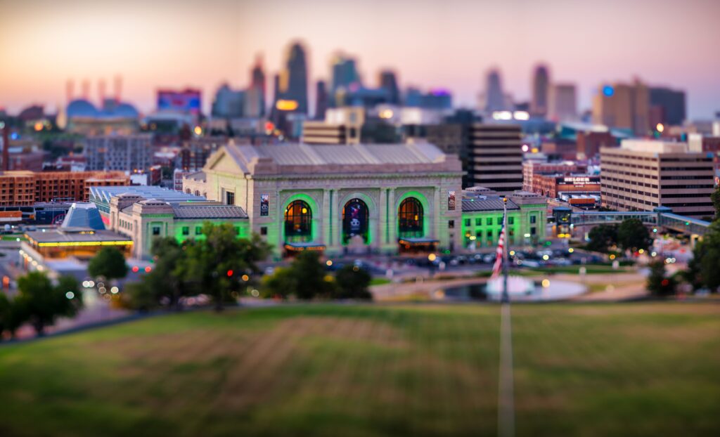 Vibrant evening view of Kansas City, Kansas with Union Station illuminated in green color