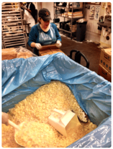 Woman at the Houston Food Bank with the food supplies provided by the Lanier Law Firm