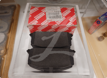 Asbestos-containing break pads