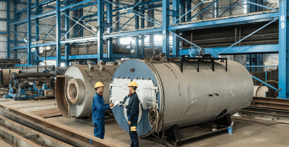 Factory workers near boilers