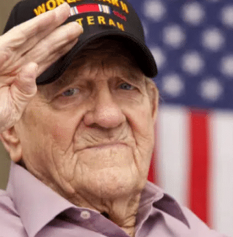 WWII veteran with mesothelioma risk, saluting