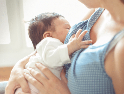 Woman Breastfeeding Baby