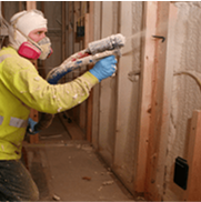 Person applying asbestos-containing insulation
