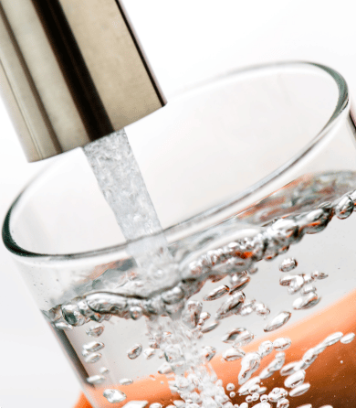 Glass filling with water from the tab