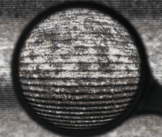 Magnifying glass over asbestos