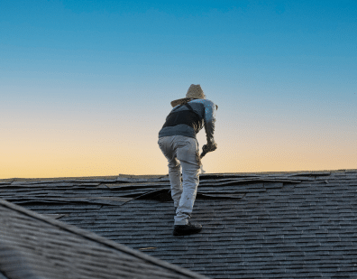 Roofer Working With Asbestos Shingles