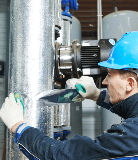 Man working on pipe containing asbestos