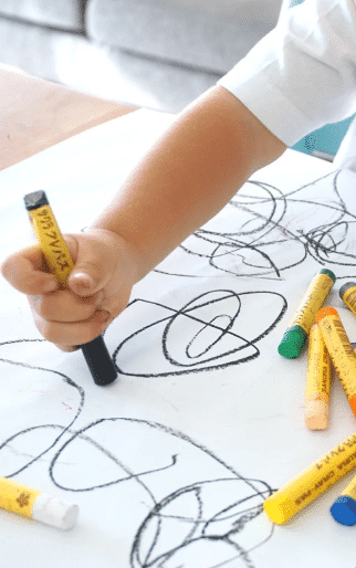 Child Drawing With Asbestos Containing Crayons