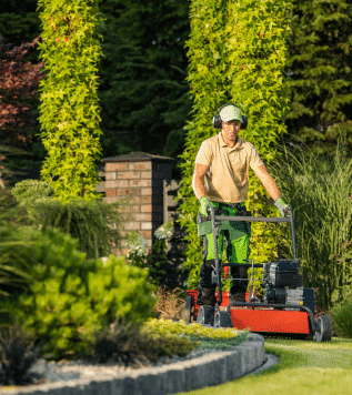 Man Mowing Lawn With Asbestos Containing Lawn Mower