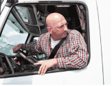 Truck driver looking out their truck window