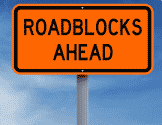 Sign that reads "roadblocks ahead"