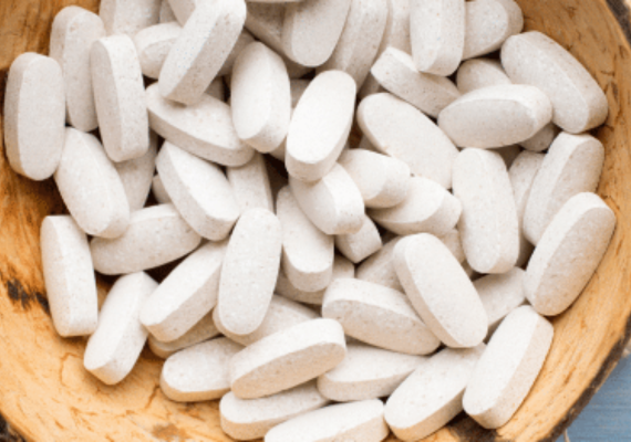 Dozens of white pills