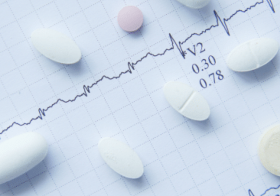 Pills over an electrocardiogram