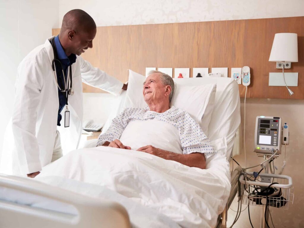Doctor Examining Mesothelioma Patient During Chemotherapy