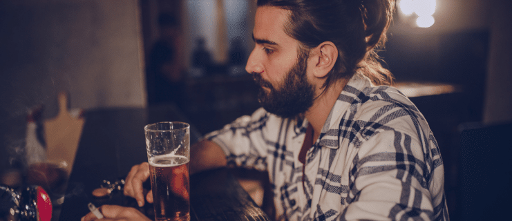 Truck driver at a bar drinking beer