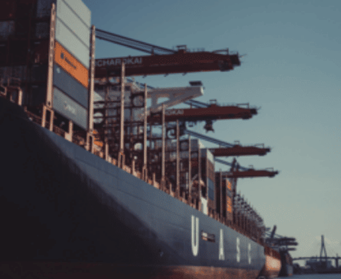 Massive cargo ship the multiple cranes on deck