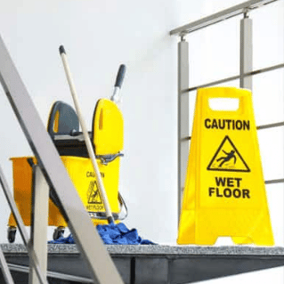 Wet floor sign on stairs