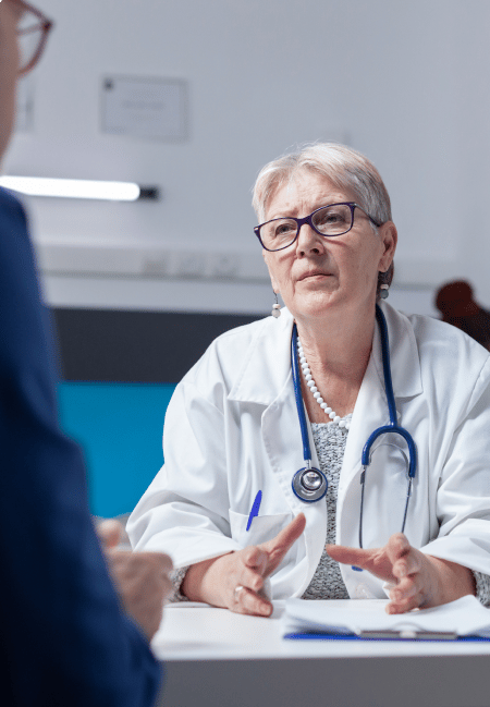 Senior female doctor explaining mesothelioma to a patient