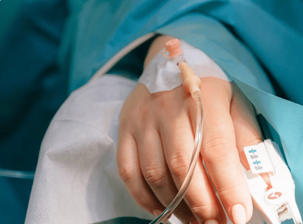 IV entering a patient's hand for stage 1 mesothelioma chemotherapy