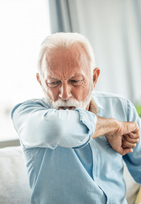 Senior man coughing